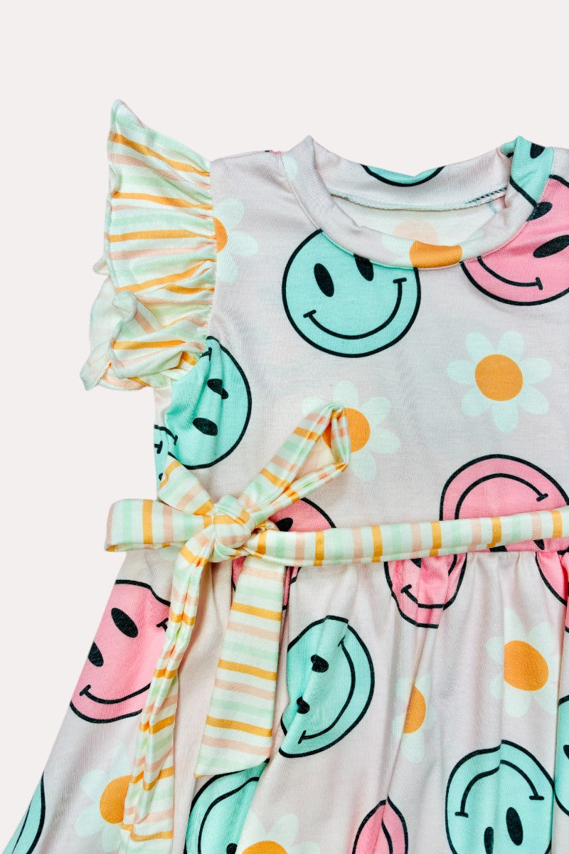 D2337 Pink & aqua smiley faces w/daisies print swirl dress