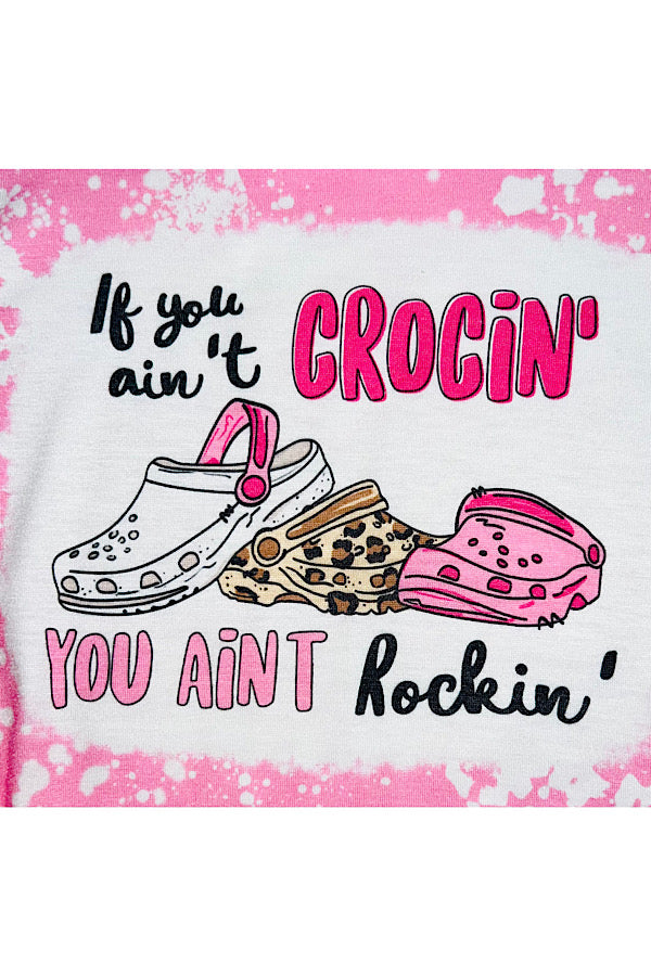 "IF YOU AIN'T CROCIN' YOU AINT ROCKIN" bleached light pink bubble romper