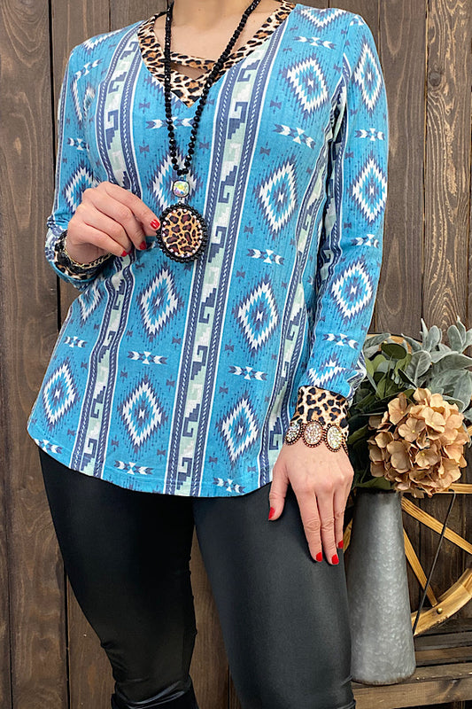 GJQ11338-1  Blue Aztec & leopard printed long sleeve top w/criss cross neckline