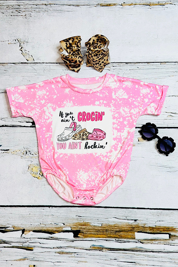 "IF YOU AIN'T CROCIN' YOU AINT ROCKIN" bleached light pink bubble romper